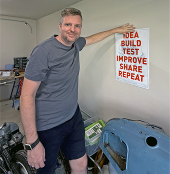 Maker Poster mounted in a frame standing on a wall